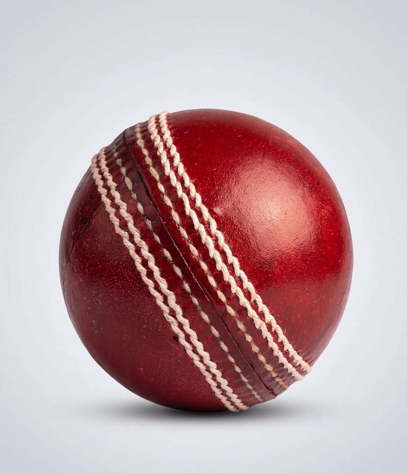 A studio shot of a red leather cricket ball ready for custom branding